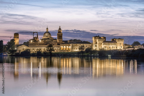 Mantova skyline reflected in Mincio lake at sunset, Lombardia, Italy