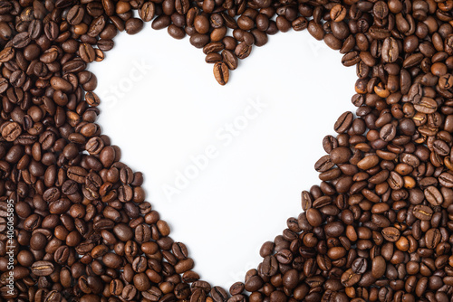 Coffee beans heart shape isolated on white background with copyspace for text. Coffee background or texture concept.