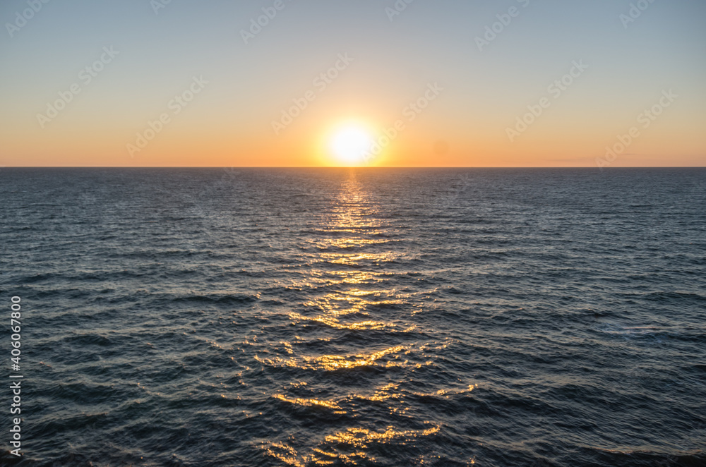 summer sunset, the sun goes out to sea, horizontal photo