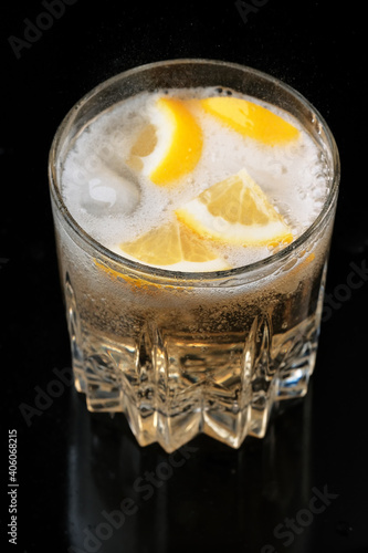 Lemonade drink with lemon and ice
