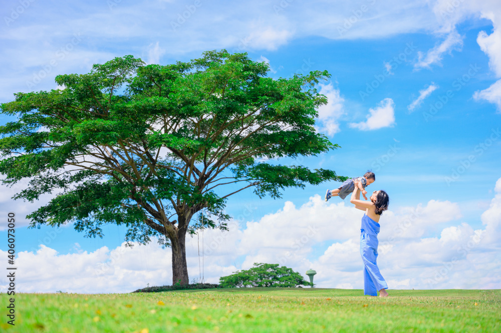 Mother And Baby outdoors. Nature.Portrait of happy loving mother and her baby outdoors Mother And Baby outdoors. Nature.Portrait of happy loving mother and her baby outdoors