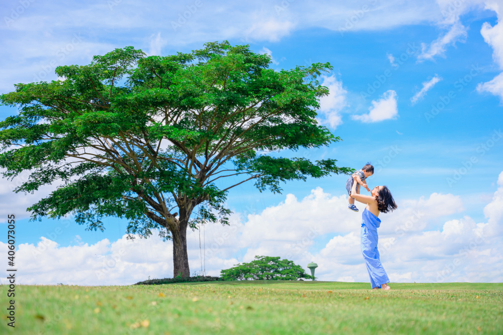Mother And Baby outdoors. Nature.Portrait of happy loving mother and her baby outdoors Mother And Baby outdoors. Nature.Portrait of happy loving mother and her baby outdoors