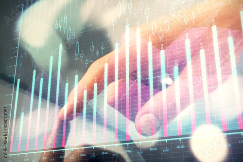 Multi exposure of man's hands holding and using a phone and financial chart drawing. Market analysis concept. © peshkova