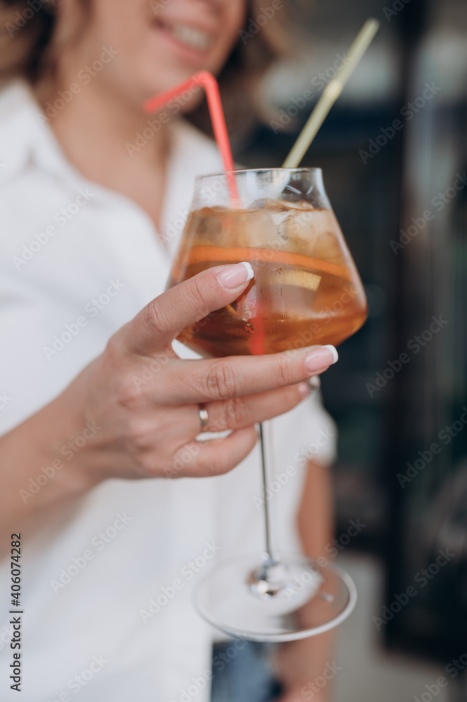 the girl holds a cocktail glass in her hand the girl holds a cocktail glass in her hand