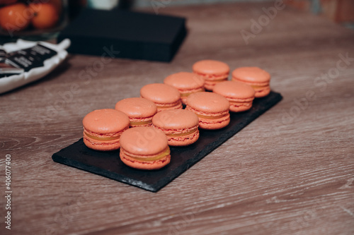 orange macaroni desserts on the table