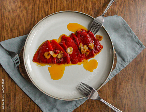 Spanish Piquillo peppers with garlic and olive oil. Spanish tapas dish.  photo