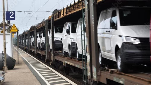 Freight Train Carrying brand new cars. Cars transported by railway from the factory