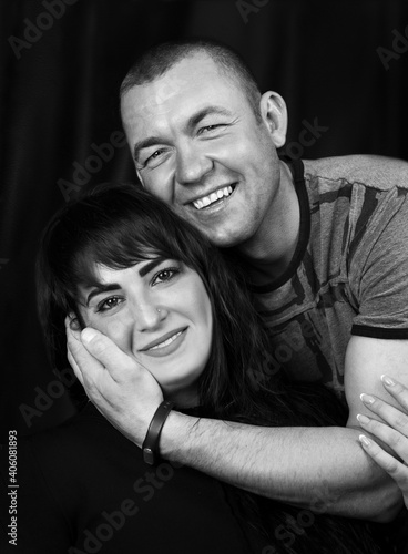 Black and white photoshoot of a couple in the studio