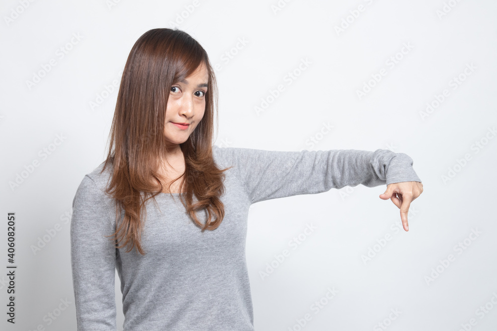 Beautiful young Asian woman point down to blank space. Beautiful young Asian woman point down to blank space.