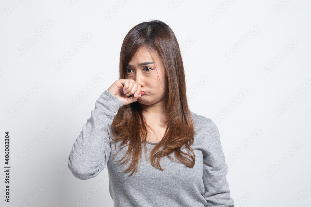 Young Asian woman holding her nose because of a bad smell. Young Asian woman holding her nose because of a bad smell.
