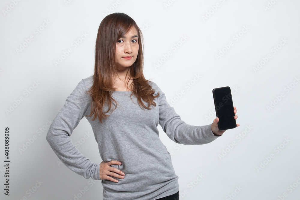 Naklejka premium Young Asian woman with mobile phone.