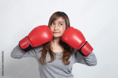 Young Asian woman with red boxing gloves. © halfbottle