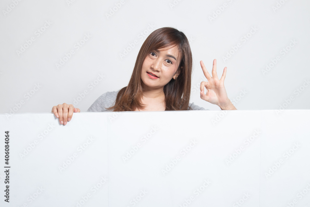Young Asian woman show victory sign with blank sign. Young Asian woman show victory sign with blank sign.