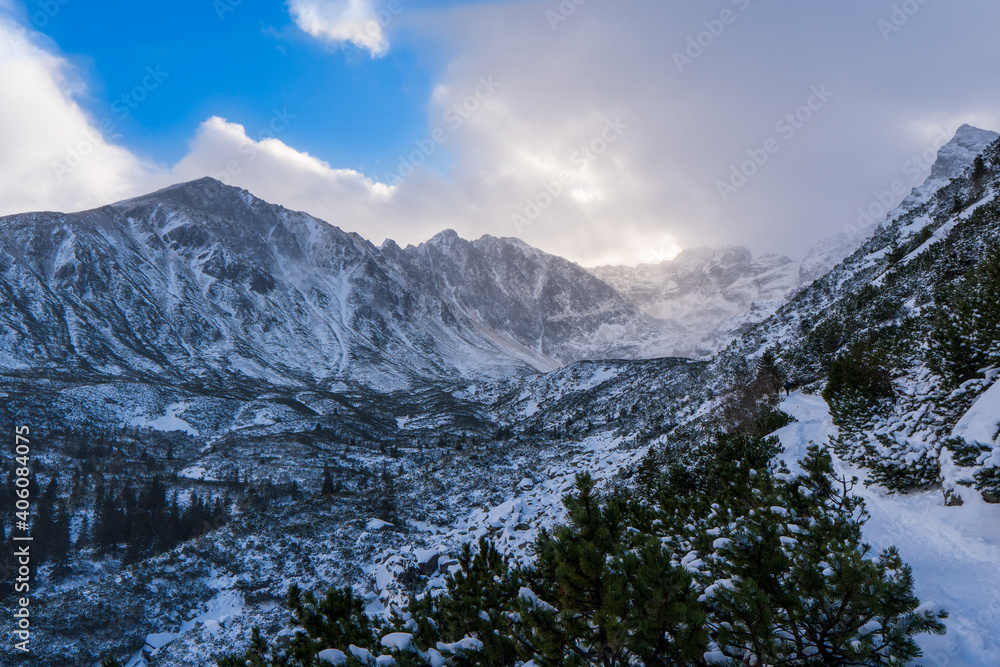 Winter landscape in the mountains in cloud day . The path in the snow. Tatry mountain, Poland , Europe