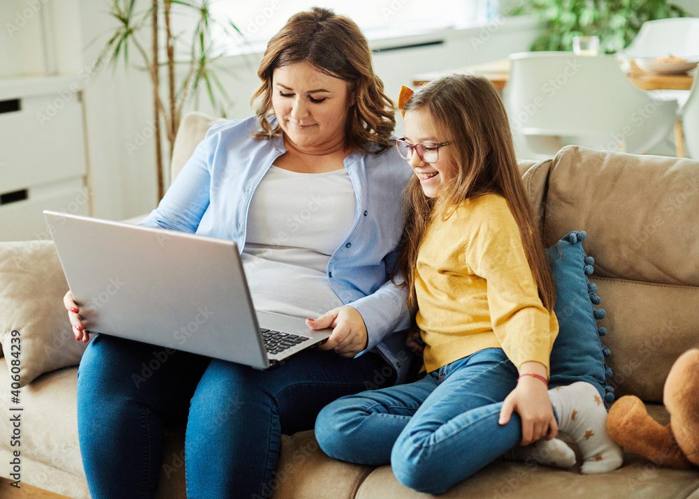 © Lumos sp - laptop computer education mother children daughter girl familiy childhood home child parent