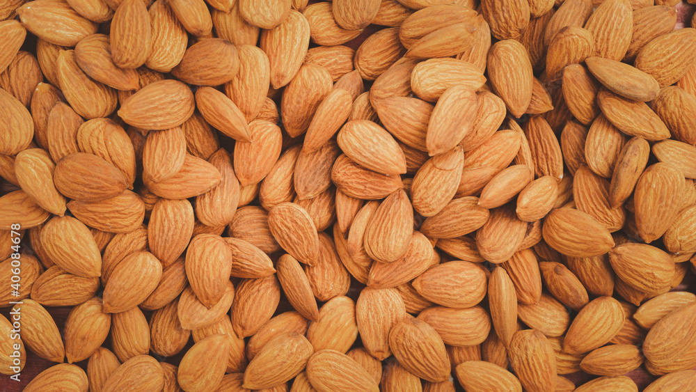 Background of big raw peeled almonds.Healthy food Concept. Background of big raw peeled almonds.Healthy food Concept.
