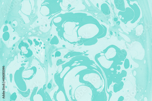 Aqua marble ink texture on watercolor paper background. Marble stone image. Bath bomb effect. Psychedelic biomorphic art.