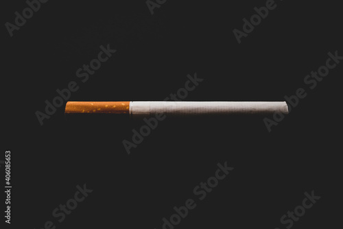 Cigarette in the dark on a black background
