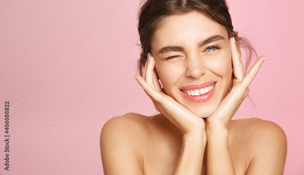 Beauty face. Happy young woman getting ready for romantic valentines day date, applying makeup and smiling. Pretty girl standing naked, nourish and hydrate skin on pink background Beauty face. Happy young woman getting ready for romantic valentines day date, applying makeup and smiling. Pretty girl standing naked, nourish and hydrate skin on pink background