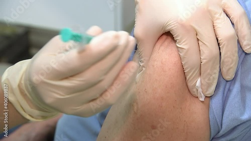 Doctor giving injection of coronavirus vaccine