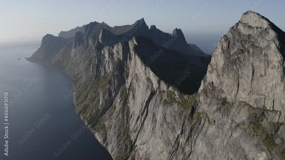 Incredible peak of Segla mountain diving into a beautiful Norwegian fjord. Lofoten Island Incredible peak of Segla mountain diving into a beautiful Norwegian fjord. Lofoten Island