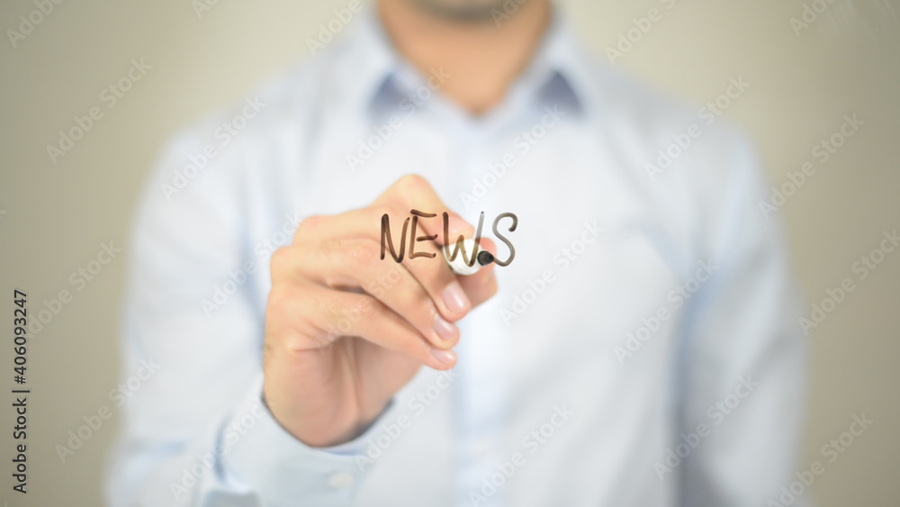 NEWS, man writing on transparent screen NEWS, man writing on transparent screen
