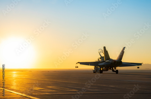 Jet fighter on an aircraft carrier deck against beautiful sunset sky Fototapet
