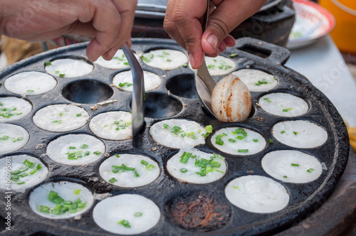 Kanom Krok Phueng, a traditional Thai dessert made from crushed coconut meat.