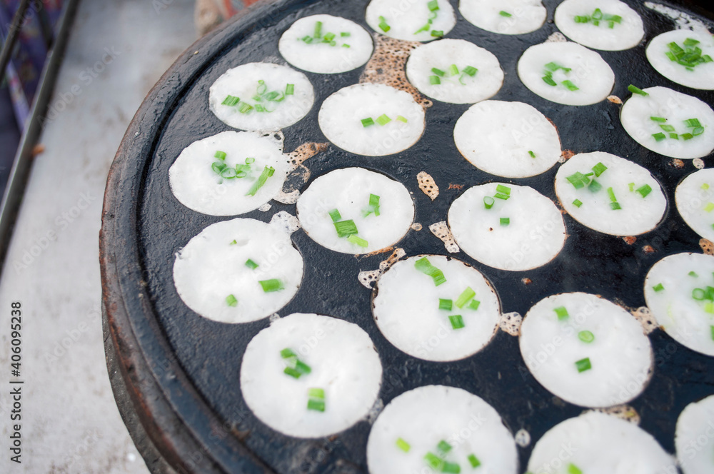 Kanom Krok, a traditional Thai dessert made from crushed coconut meat. - obrazy, fototapety, plakaty 