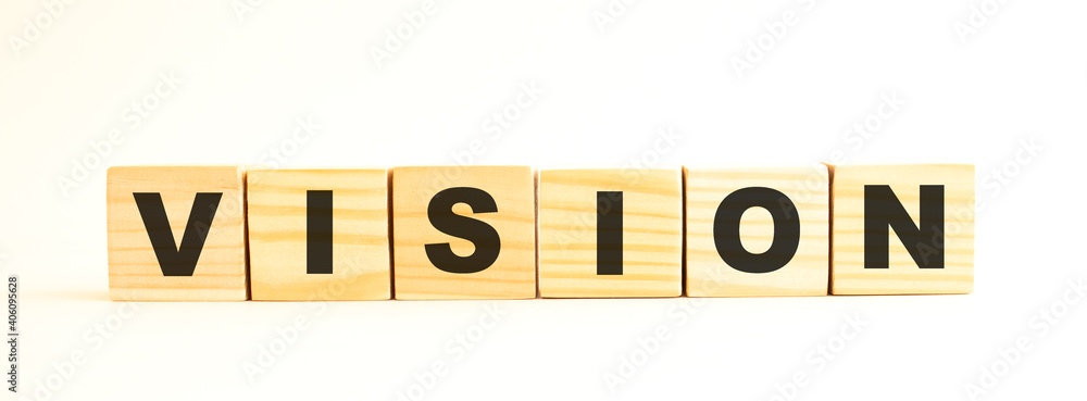 The word VISION. Wooden cubes with letters isolated on white background. The word VISION. Wooden cubes with letters isolated on white background.