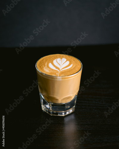 cortado latte on a table simple background