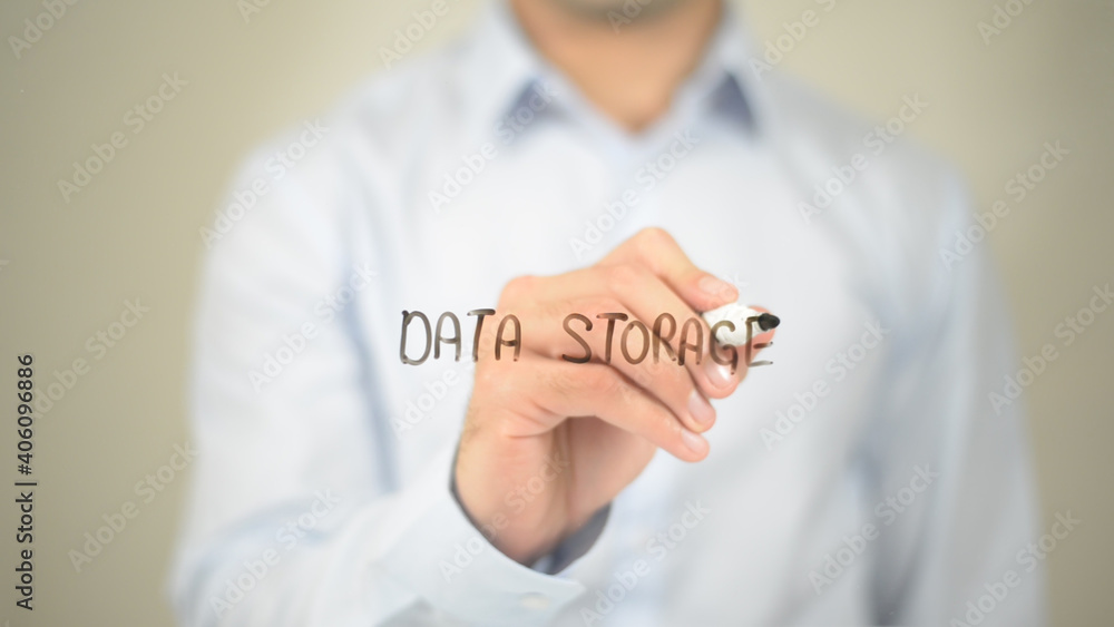 Data Storage, Man writing on transparent screen Data Storage, Man writing on transparent screen