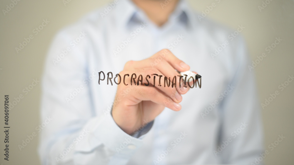 Procrastination , Man writing on transparent screen Procrastination , Man writing on transparent screen