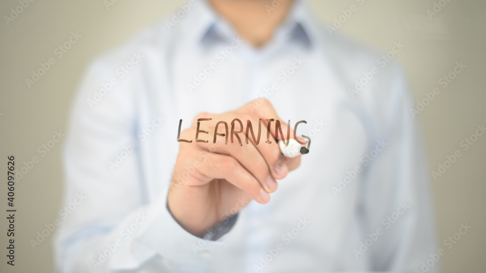 Learning , Man writing on transparent screen Learning , Man writing on transparent screen