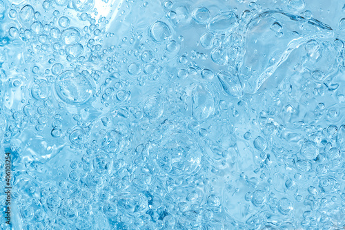 blue transparent clean drinking water abstract background. water surface with air bubbles background
