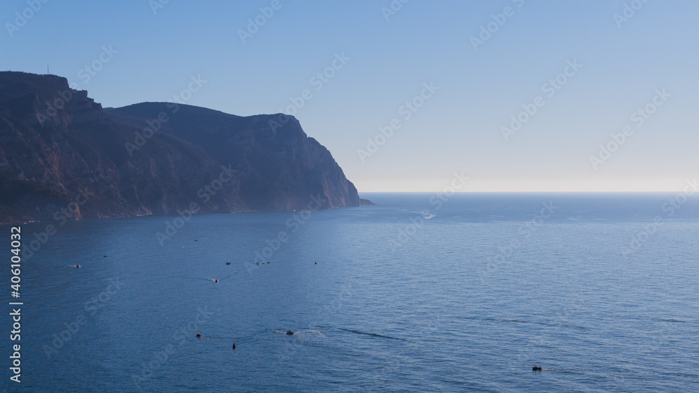 Many ships and boats on the water of Black sea in the Bay of Sevastopol with rocks and mountains Many ships and boats on the water of Black sea in the Bay of Sevastopol with rocks and mountains