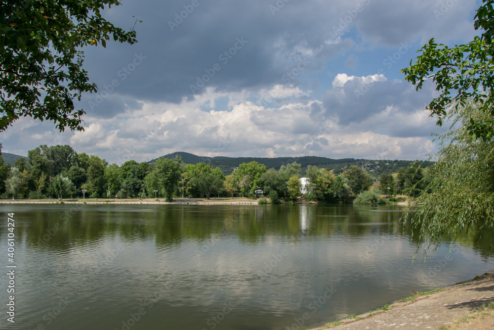 Beautiful peaceful nature, trees and plants on a lake, summertime season, reflection in the water, Zagorka lake, Stara Zagora, Bulgaria Beautiful peaceful nature, trees and plants on a lake, summertime season, reflection in the water, Zagorka lake, Stara Zagora, Bulgaria