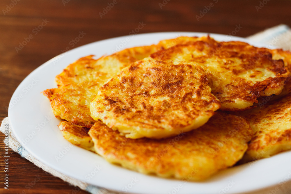 Roasted potato pancakes in white bowl