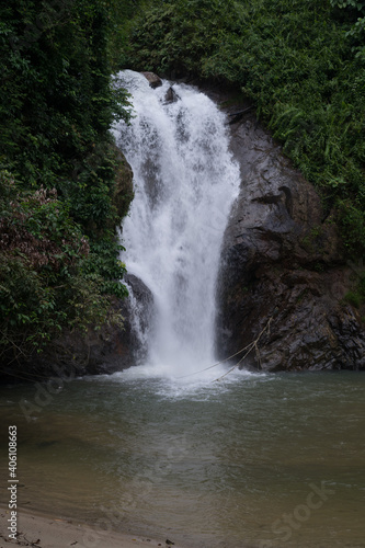 Beautiful view of rainforest waterfall in slow shutter mode.Soft focus due to slow shutter and high ISO shot.