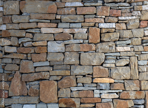 Natural stone masonry wall texture or background