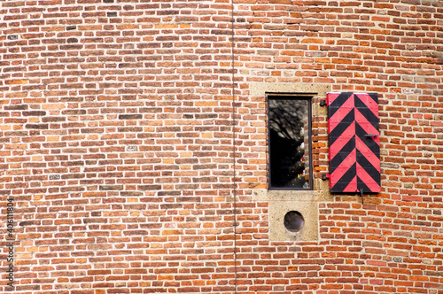 Closeup of the facade with window of the Kruittoren in Nijmegen in the Netherlands