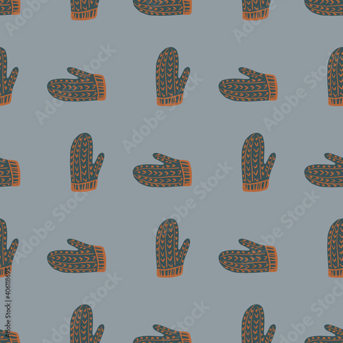 Dark grey colored hand drawn mittens print seamless pattern. Cozy warm ornament on blue background.