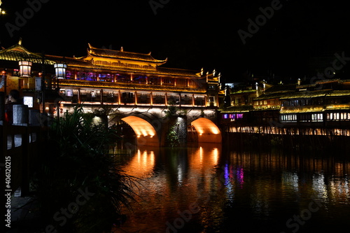 Night lights andtraditional bridge in the city of fenghuang, China