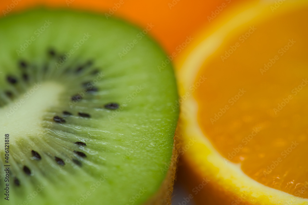 close up of sliced Kiwi fruit and citrus Orange close up of sliced Kiwi fruit and citrus Orange