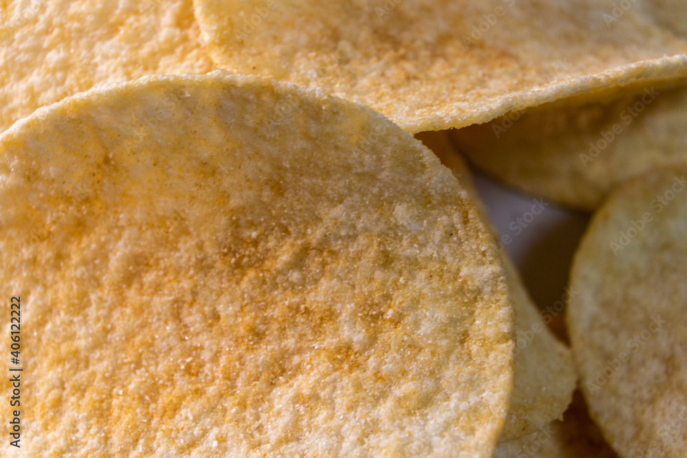 Closeup Plain Potato Chips (Crisps) on white table.