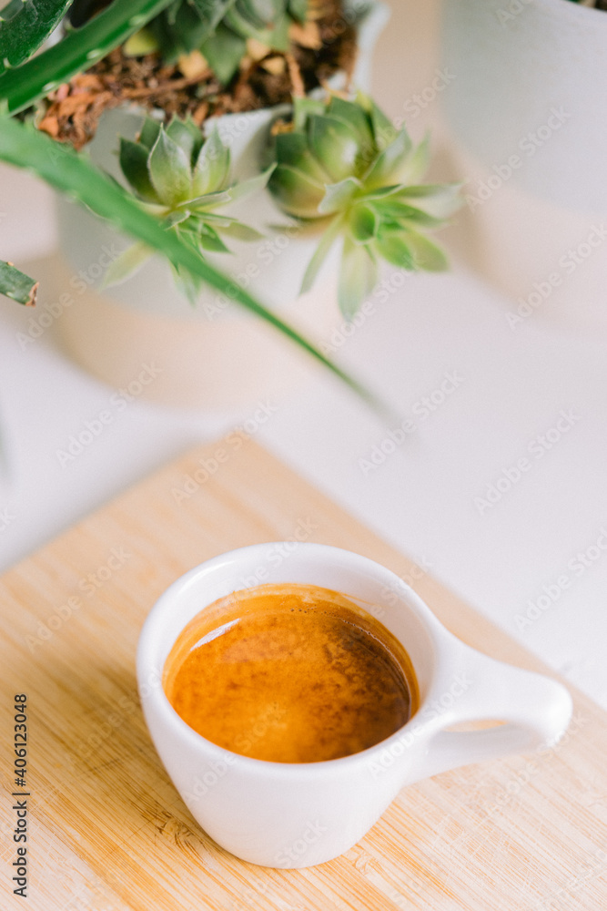 cup of tea and coffee next to plants cup of tea and coffee next to plants