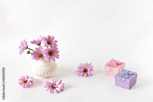 Romantic lovely bouquet of fresh pink chrysanthemums. Gift boxes on white background. Congratulations on Valentine s Day  Birthday or March 8th. Empty space for text. Close-up  copy space  mock up