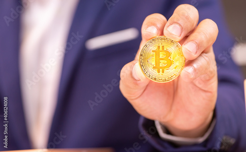 person holding a gold coin