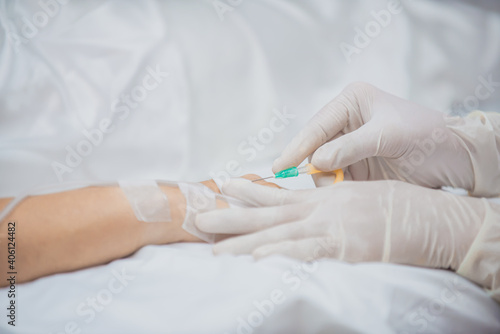 close up of a nurse holding a syringe