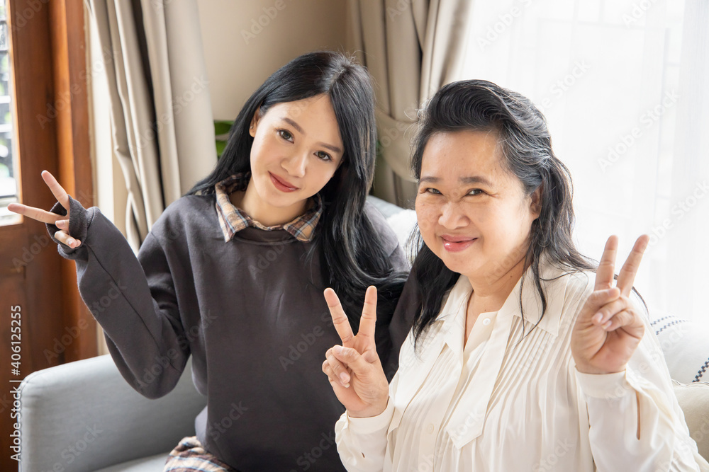 Lovely asian senior mother and young daughter with happy family life, single mom, togetherness concept Lovely asian senior mother and young daughter with happy family life, single mom, togetherness concept